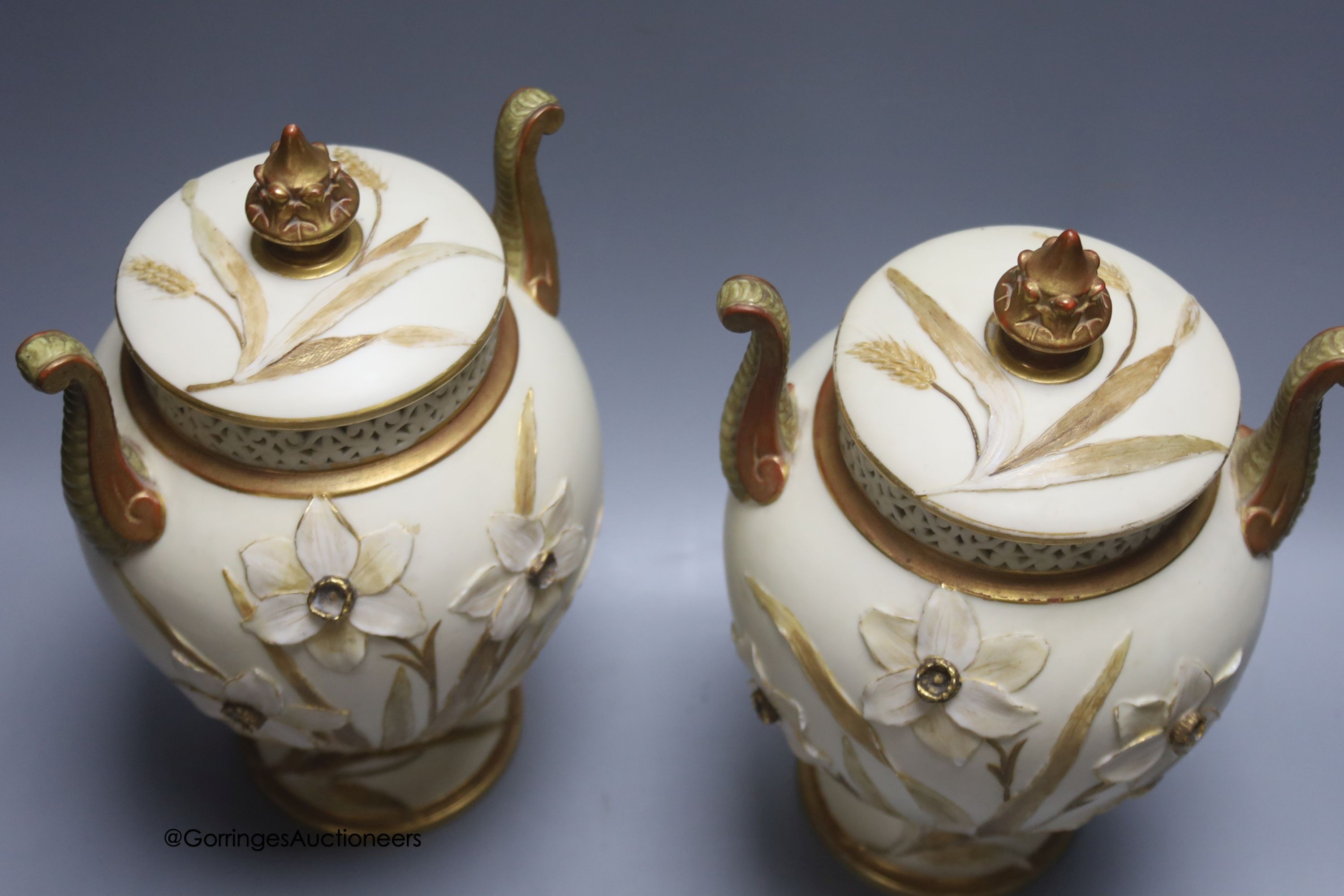 A pair of Grainger & Co. Worcester Royal China Works porcelain pot pourri vases and covers, height 28cm